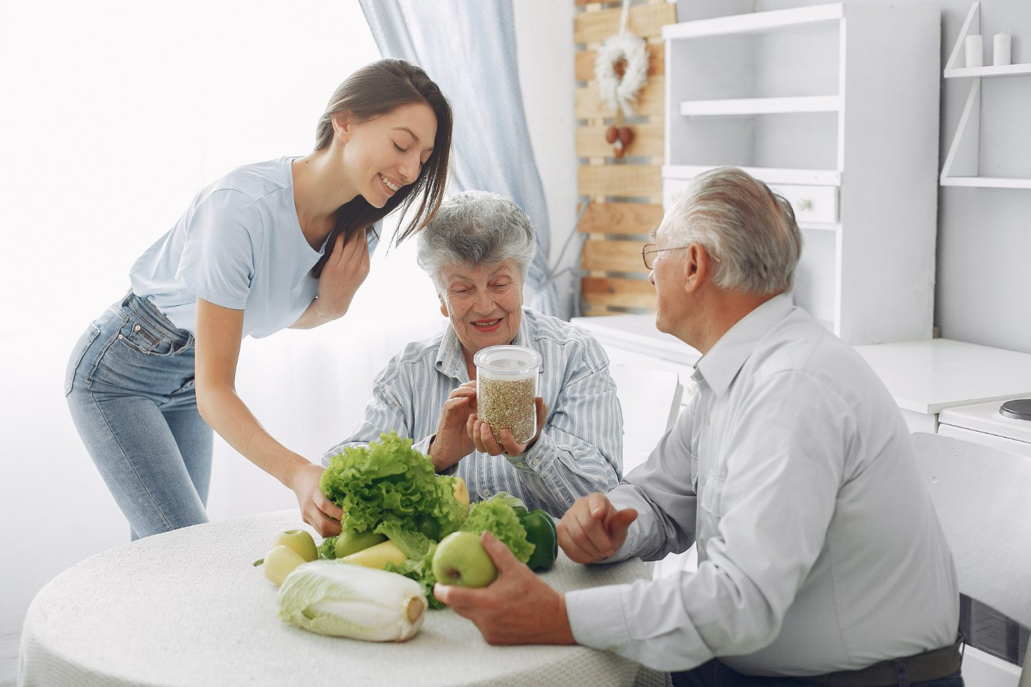 couple in a kitchen with young granddaughter