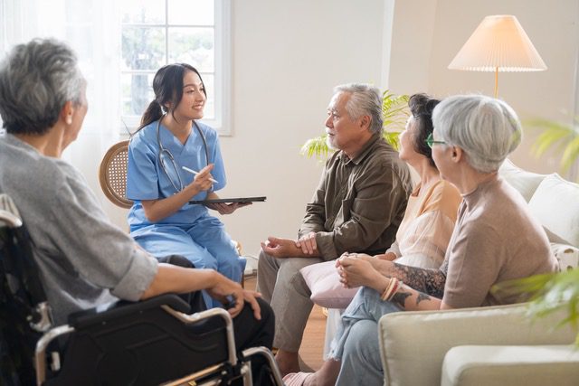 people looking over picture albums